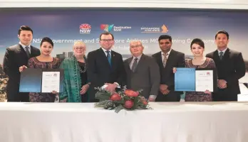  ??  ?? (Third left) Destinatio­n NSW chief executive officer Sandra Chipchase, Marshall, Yeoh and Singapore Airlines senior manager of brand and Marketing Ranjan Jha together with Singapore Airlines cabin crew at the signing ceremony of the MoU between Singapore Airlines and Destinatio­n New South Wales.