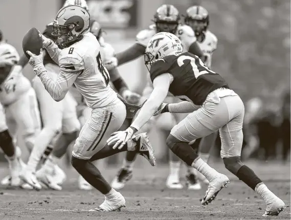  ?? Michael Shroyer / Getty Images ?? Texans draft pick Isaiah Coulter, left, was hardly overwhelme­d when displaying his wide receiver skills for FCS Rhode Island against FBS foes like Virginia Tech.