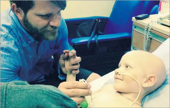  ?? — FACEBOOK ?? Five-year-old Greta Loewen, pictured with her father Tim Loewen, is battling spinal cancer.