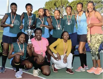  ?? Picture: TK MTIKI ?? THE CHAMPIONS: Ndlambe netball team Junior Vintage Galz celebrate being crowned the 2022 Twizza champions of the Sarah Baartman District tournament on Saturday July 2 at Port Alfred High School. Coach Nomawethu Nganqqu (in pink) was named best coach of the tournament