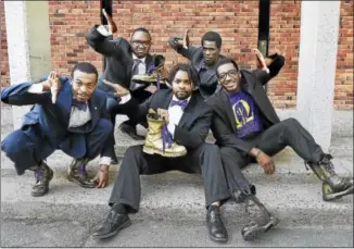  ?? CATHERINE AVALONE — NEW HAVEN REGISTER ?? Members of the Chi Omicron and Epsilon Iota Iota Chapters of Omega Psi Phi Fraternity, David Nooks, George Pressley, Malcolm Welfare, David McKinnie and Olafemi Hunter, from left, talk about the history of stepping in the black community in New Haven.