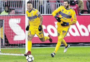  ?? FRANK GUNN / THE CANADIAN PRESS ?? Renowned UANL Tigres striker Eduardo Vargas, left, figures to command much of the attention for the Toronto FC defenders.