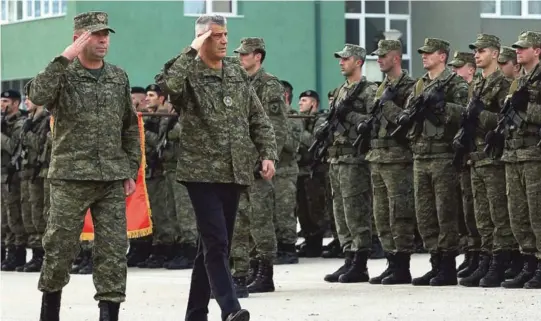  ??  ?? Kosovos president Hashim Thaci inspiserte fredag Kosovos kommende haer, som blir opprettet til protester fra Serbia og NATO. ALLE FOTO: NTB SCANPIX