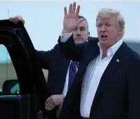  ?? (Jonathan Ernst/Reuters) ?? US PRESIDENT Donald Trump waves to reporters in Maryland yesterday, as he disembarks from Air Force One upon his return from Singapore.