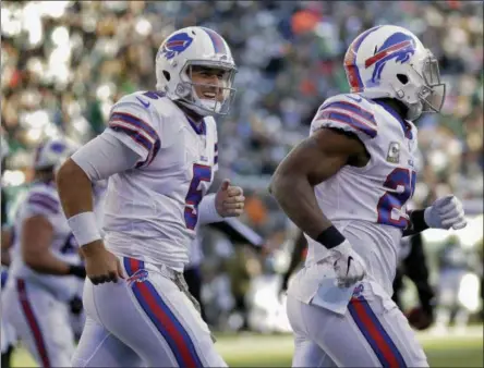  ?? SETH WENIG - THE ASSOCIATED PRESS ?? Buffalo Bills quarterbac­k Matt Barkley (5) celebrates with Buffalo Bills running back LeSean McCoy (25) after McCoy scored a touchdown against the New York Jets during the second quarter NFL football game, Sunday, Nov. 11, 2018, in East Rutherford, N.J.