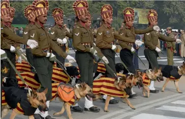  ?? — AFP ?? The Indian Army’s dog squad rehearses for the upcoming Republic Day parade on Rajpath in New Delhi on Monday.