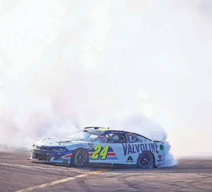  ?? ALEX GOULD/ARIZONA REPUBLIC ?? NASCAR Cup Series driver William Byron does a victory burnout after winning the United Rentals Work United 500 at Phoenix Raceway.