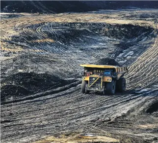  ?? JULIA KILPATRICK/WWW.PEMBINA.ORG ?? A heavy hauler truck makes its way across the Shell Albian Sands’ Jackpine mine, north of Fort McMurray. “I think it’s safe to say that we’re not looking at a return to booming growth,” said Michael Burt of the Conference Board of Canada. Still, a...