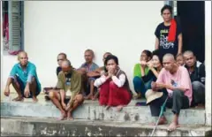  ?? ERIN HANDLEY ?? Detainees sit on the steps of a building at Phnom Penh’s Prey Speu social affairs centre last year.