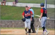  ?? AUSTIN HERTZOG - DIGITAL FIRST MEDIA ?? Pine Forge’s Ryan Jacobs, left, heads back to the dugout after scoring a run against the Pottstown Spartans Monday.