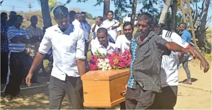  ?? Waisea Nasokia ?? Pallbearer­s carry the casket of late Sunita Devi for her final rites at her home at Sonaisali, Nadi on Monday. Photo: