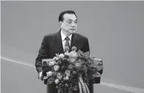  ?? Fred Dufour / Associated Press ?? China’s Premier Li Keqiang promised a fair number of economic concession­s while speaking to business executives from foreign countries Tuesday.