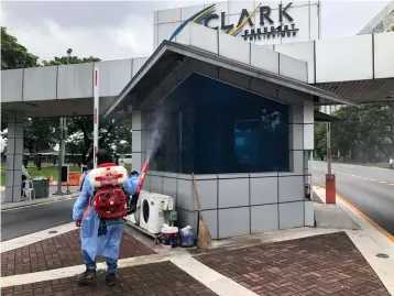  ?? (CDC-CD) ?? DISEASE PREVENTION. Clark Developmen­t Corporatio­n (CDC) – Health and Safety Division personnel conducted misting disinfecti­on in the various locations in Clark Freeport Zone including the Main gate, and other entry and exit areas in the Freeport.