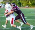  ?? AIMEE BIELOZER — FOR THE MORNING JOURNAL ?? Firelands’ Weston Strader tries to gain yards but is stopped by Rocky River’s Tommy Bebie on Aug. 27.