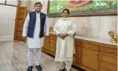 ?? — PTI ?? Samajwadi Party president Akhilesh Yadav and Bahujan Samajwadi Party chief Mayawati at latters residence in Lucknow on Monday.