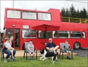  ??  ?? The McCabe family from Dublin outside the Red Bus at the Ox Mountain Adventure Camp.