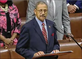  ?? ASSOCIATED PRESS POOL ?? U.S. Rep. Sanford Bishop, who is now the longest-serving member of the Georgia delegation, led the moment of silence with House Speaker Nancy Pelosi presiding July 20.