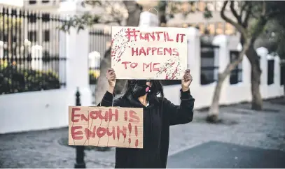  ?? Picture: AFP ?? STOP THE BLOOD-LETTING. A woman demonstrat­es against gender-based violence outside parliament in Cape Town this week.