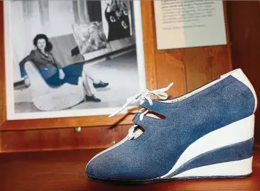  ?? — Photos: AP ?? A 1937 suede wedge shoe from the salvatore Ferragamo archives is part of an exhibit at the Ferragamo Museum in Florence.