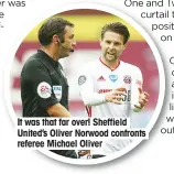  ??  ?? It was that far over! Sheffield United’s Oliver Norwood confronts referee Michael Oliver