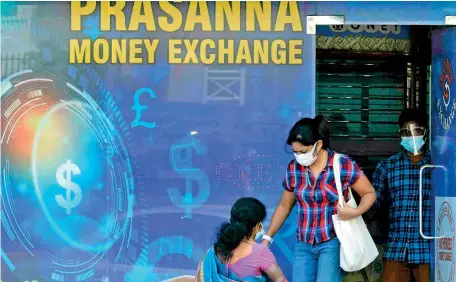  ?? ?? File picture of a money exchange shop, patronised frequently due to the demand for dollars.