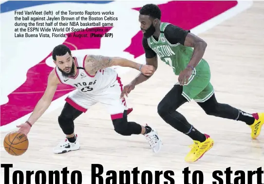  ?? (Photo: AFP) ?? Fred Vanvleet (left) of the Toronto Raptors works the ball against Jaylen Brown of the Boston Celtics during the first half of their NBA basketball game at the ESPN Wide World Of Sports Complex in
Lake Buena Vista, Florida, in August.