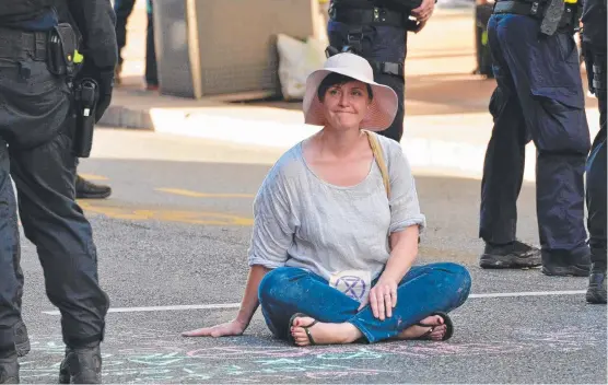  ?? Picture: Extinction Rebellion/Facebook ?? CLIMATE ACTION: Alison Fearnley takes part in the Extinction Rebellion rally in Brisbane on Monday.