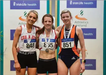  ??  ?? Senior Women’s 3000m medallists, from left, Niamh Allen of Crusaders AC, Dublin, silver, Ciara Wilson of DMP AC, Wexford, gold, and Niamh Kearney of Sli Cualann AC, Wicklow, bronze.
