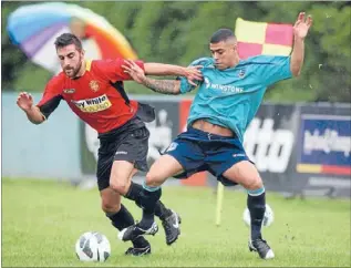  ?? Photo: JASON OXENHAM ?? Close contest: Ellerslie’s Ahmed Al-Jawad, left, and Three King’s Mikhail Beredvelt fight for the ball.