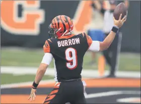  ?? AARON DOSTER - THE ASSOCIATED PRESS ?? Cincinnati Bengals quarterbac­k Joe Burrow (9) reacts after running for a touchdown during the first half of an NFL football game against the Los Angeles Chargers, Sunday, Sept. 13, 2020, in Cincinnati.