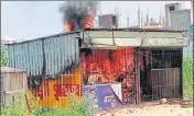  ?? PTI ?? The liquor shop that was burnt by protestors.