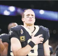  ?? Gerald Herbert / Associated Press ?? New Orleans Saints quarterbac­k Drew Brees holds his hand to his heart during the national anthem before a game against the Pittsburgh Steelers in New Orleans in 2018.