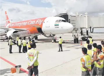  ??  ?? An Airasia India plane is seen in this file photo. — Reuters photo