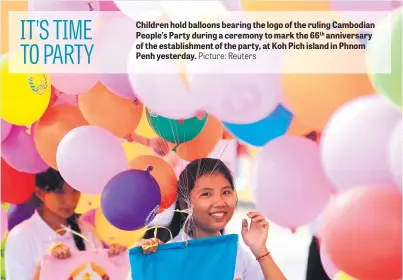  ?? Picture: Reuters ?? Children hold balloons bearing the logo of the ruling Cambodian People’s Party during a ceremony to mark the 66th anniversar­y of the establishm­ent of the party, at Koh Pich island in Phnom Penh yesterday.