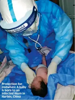  ??  ?? Protection for midwives: A baby is born to an infected mum in Harbin, China
