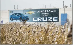  ?? The New York Times/ALLISON FARRAND ?? A banner depicting the Chevrolet Cruze model vehicle is displayed at the General Motors plant in Lordstown, Ohio, in November. GM closed the plant earlier this month.