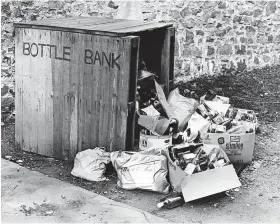  ?? ?? The waste that everyone hated – glass bottles at an overflowin­g bottle bank in Hotwells in the 1980s