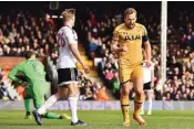  ??  ?? Tottenham Hotspur’s Harry Kane (right) celebrates after scoring against Fulham in their FA Cup fifth-round match at Craven Cottage in west London on Sunday