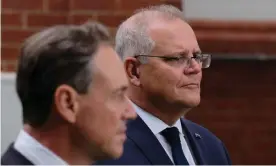  ?? Photograph: Luis Ascui/AAP ?? Scott Morrison (right) rejects claims Australia missed out on securing vaccines supplies from Pfizer after revelation­s that Greg Hunt (left) turned down an offer to meet with the company in 2020.