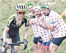  ??  ?? Vuelta a Espana champion Simon Yates(L) will sit out this year's race after competing in the Giro d'Italia and the Tour de France. - AFP photo
