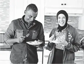  ??  ?? Marcus Samuelsson tests out some home cooking with Detroit pastry chef Lena Sareini on his travels around the U.S. for “No Passport Required.”