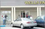  ?? KARL MONDON — STAFF PHOTOGRAPH­ER ?? News crews try to photograph any of the 11 employees at the Wells Fargo branch on Branham Lane in San Jose who won the $543 million Mega Millions jackpot last week.