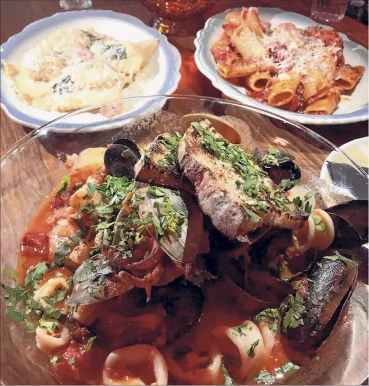  ?? Photos by Susie Davidson Powell / For the Times Union ?? Among the savory dishes at Rosanna’s are, clockwise from top, ravioli alla Rosanna, pasta Bolognese and zuppa di pesce.