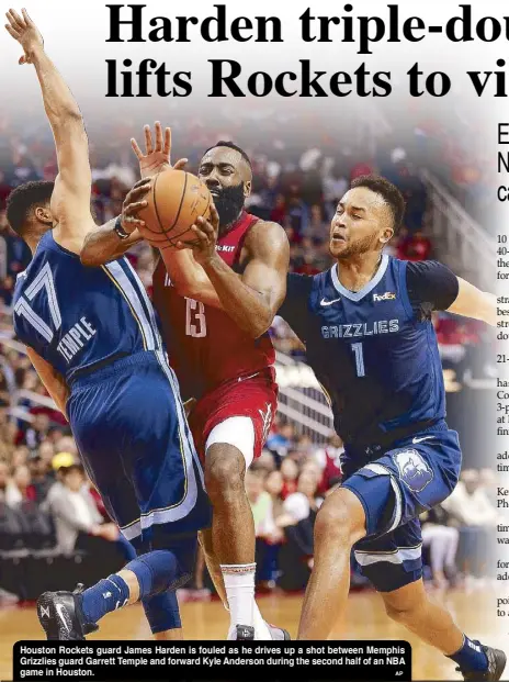  ?? AP ?? Houston Rockets guard James Harden is fouled as he drives up a shot between Memphis Grizzlies guard Garrett Temple and forward Kyle Anderson during the second half of an NBA game in Houston.