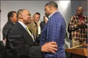  ?? JEFF AMY / AP ?? NAACP President Derrick Johnson (right) speaks with Dr. Robert Smith, former president of the Medical Committee for Human Rights, Saturday at the opening of twin history and civil rights museums.
