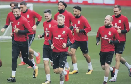  ??  ?? Sunderland’s Jonny Williams (second from right) joins Wales in training ahead of tonight’s do-or-die clash with the Republic of Ireland.