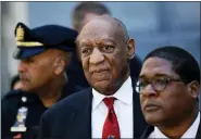  ?? MATT SLOCUM — THE ASSOCIATED PRESS FILE ?? Bill Cosby, center, leaves the Montgomery County Courthouse in Norristown in April 2018 after being convicted of drugging and molesting a woman.