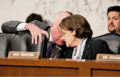  ?? J. Scott Applewhite/Associated Press ?? Sen. Patrick Leahy, then chairman of the Senate Judiciary Committee, left, leans in to speak with Sen. Dianne Feinstein, D-Calif., during a hearing to assess the impact of the Defense of Marriage Act, DOMA, which Feinstein was trying to repeal, on Capitol Hill in Washington on July 20, 2011. After Feinstein, the nation’s oldest sitting U.S. senator, died at age 90, LGBTQ+ leaders are lauding her as a longtime friend dating to a time when not many could be found.