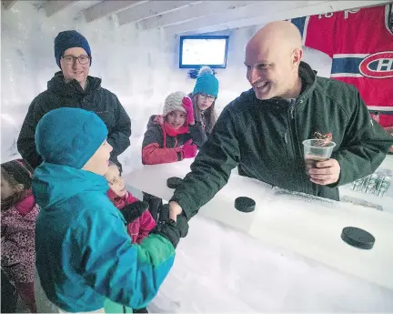  ?? PIERRE OBENDRAUF ?? Derek Parker greets visitors during a Habs game party at his backyard ice castle in Brossard earlier this month.