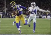  ?? MARCIO JOSE SANCHEZ - THE ASSOCIATED PRESS ?? Los Angeles Rams running back Todd Gurley scores past Dallas Cowboys cornerback Chidobe Awuzie during the first half in an NFL divisional football playoff game Saturday, Jan. 12, 2019, in Los Angeles.